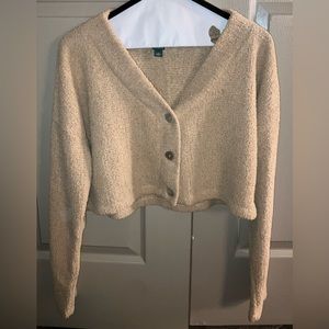 Women’s long sleeved cut off button up sweater